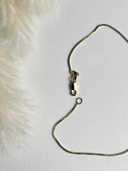 Close-up of the clasp on the birthstone necklace with two stones, featuring an 18k gold-filled box chain. The detailed view highlights the secure closure and fine craftsmanship of this meaningful, elegant piece.