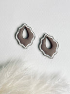 Versilana, chocolate polymer clay charm earring, add personality to your favorite hoops — a warm, elegant display highlighting the charm’s soft tone and minimalist design.