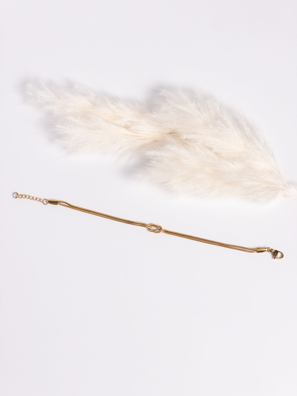 Grace Knot Bracelet gold infinity knot bracelet flat view showing clasp and extender chain