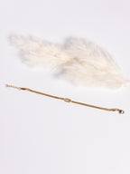 Grace Knot Bracelet gold infinity knot bracelet flat view showing clasp and extender chain