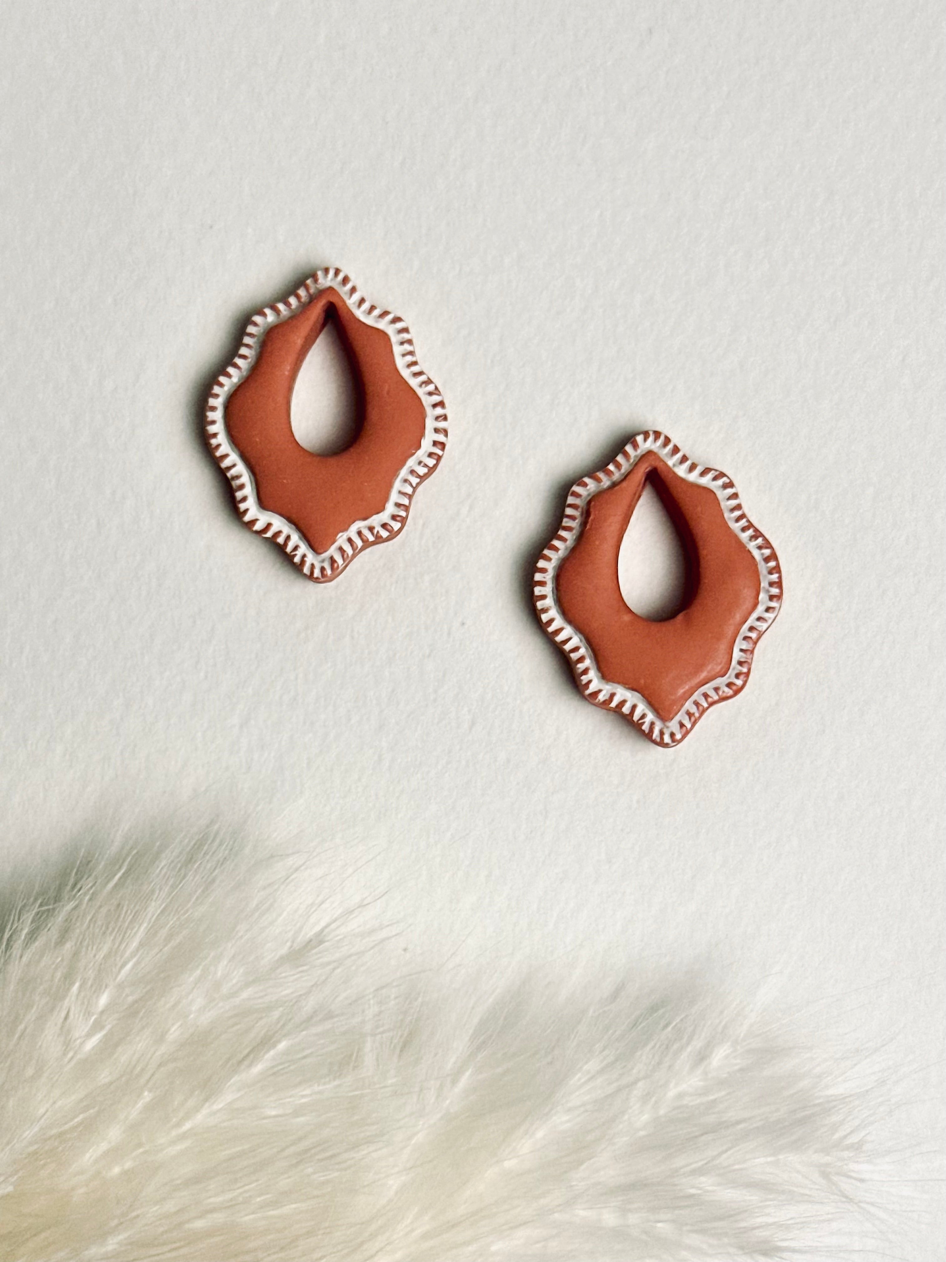 Versilana, soft terracotta polymer clay charm earring, add personality to your favorite hoops — a warm, elegant display highlighting the charm’s soft tone and minimalist design.