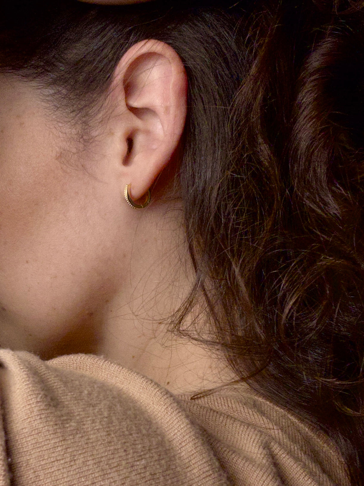 Model wearing Grace Thread gold vermeil hoop earrings with delicate rope texture.