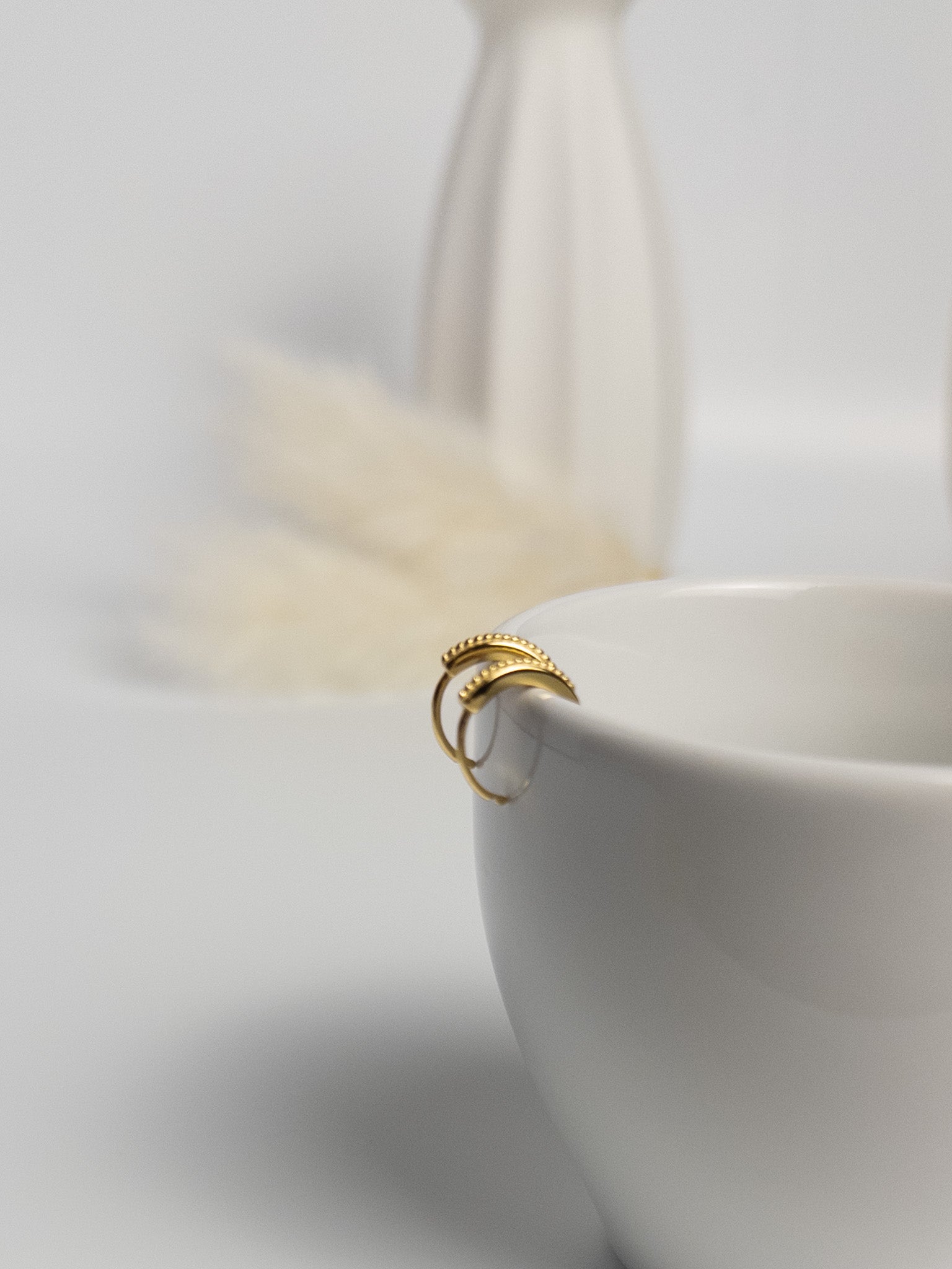 Grace Thread rope hoop earrings close-up showing twisted rope texture