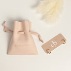 Grace Thread rope hoop earrings packaging showing earrings on display card and Amate Studio branded microfiber pouch