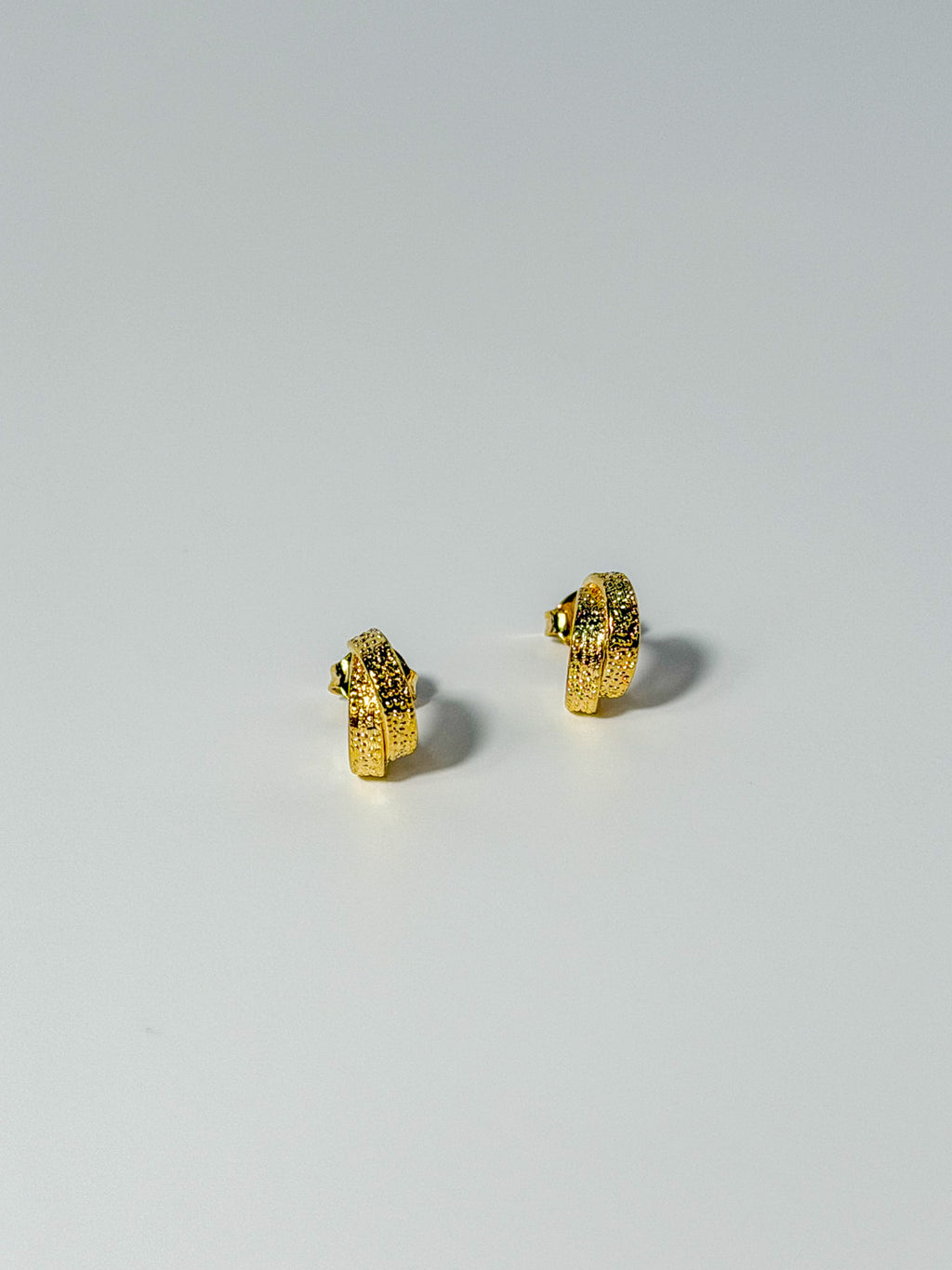 Lucía Hoop double C textured hoop earrings showing the front detail