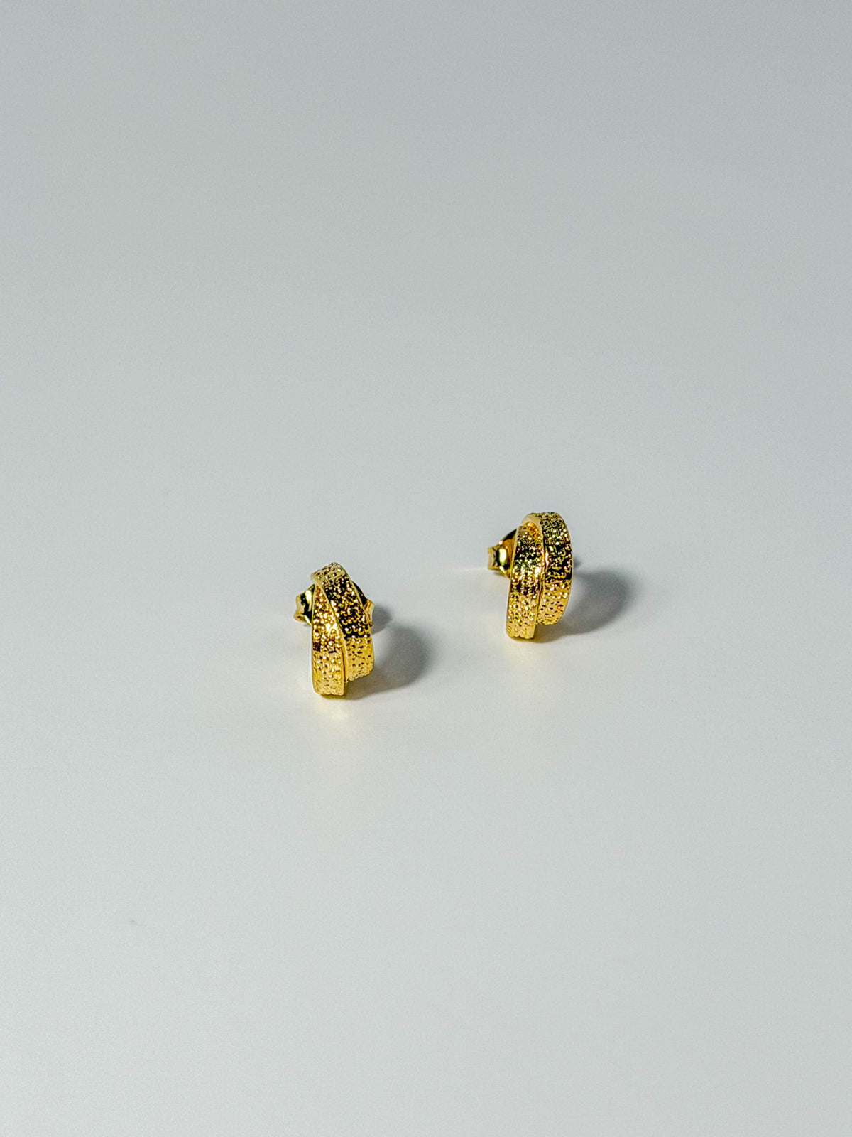 Lucía Hoop double C textured hoop earrings showing the front detail