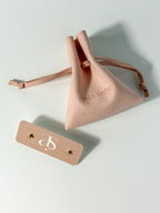Lucía Studs tiny triangle CZ stud earrings with microfiber pouch and earring card