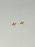 Lucía Studs tiny triangle CZ stud earrings in a flatlay