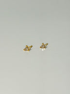 Lucía Studs tiny triangle CZ stud earrings in a flatlay