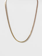 Lumen Chain snake necklace displayed in a front view showcasing a minimalist gold snake chain design.