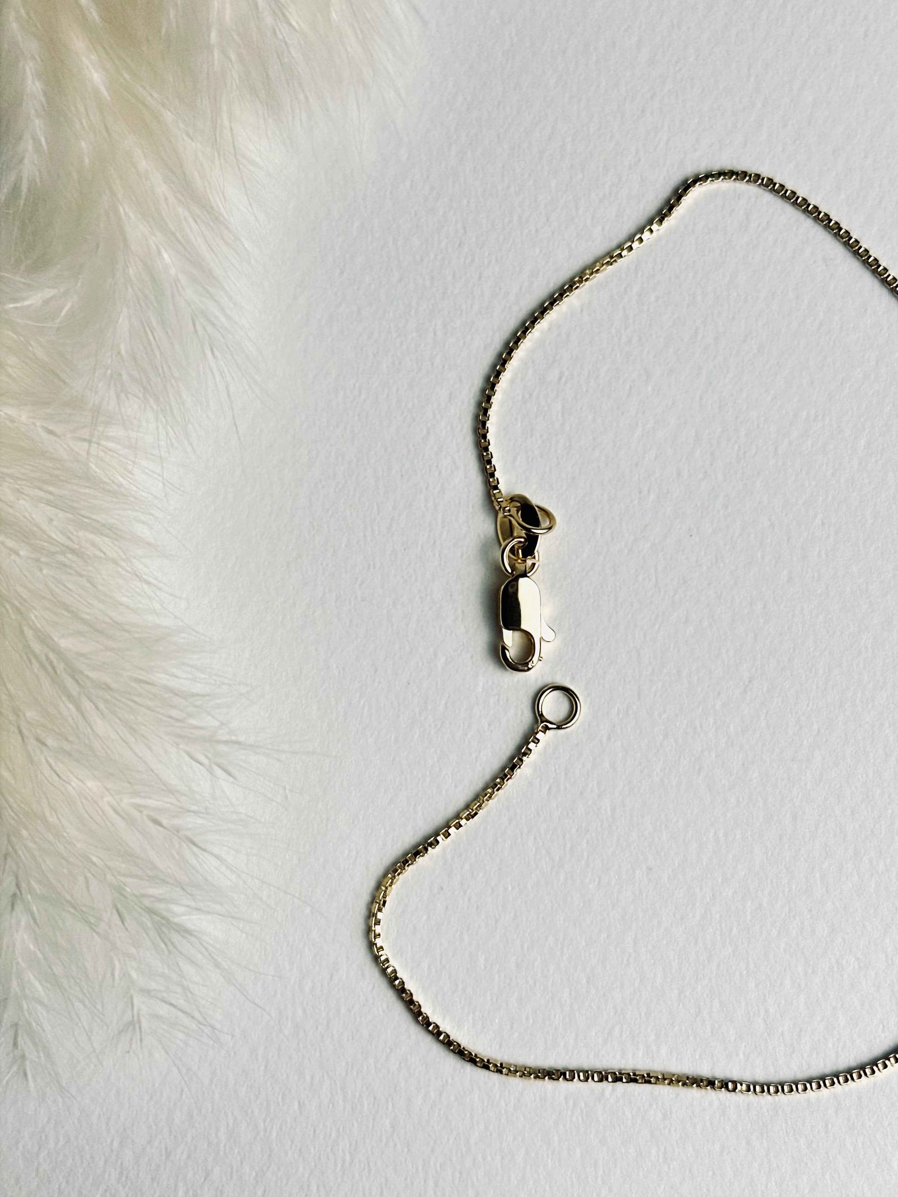 Close-up of the clasp on the birthstone necklace with two stones, featuring an 18k gold-filled box chain. The detailed view highlights the secure closure and fine craftsmanship of this meaningful, elegant piece.