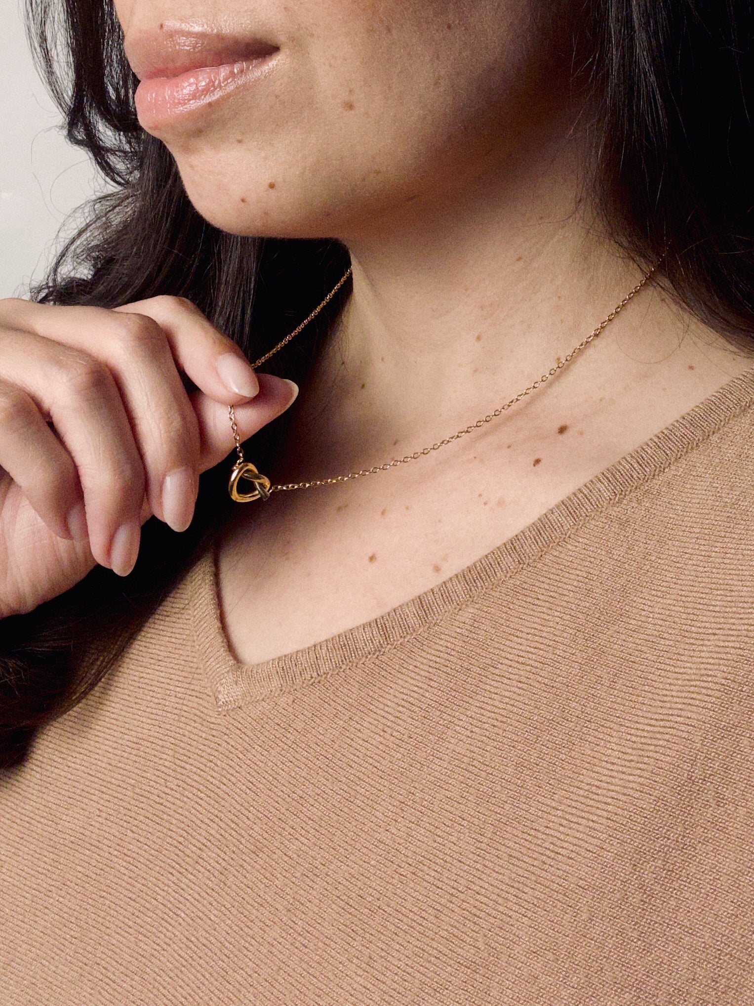 Model wearing Grace Heart gold vermeil necklace featuring a delicate heart pendant, minimalist everyday jewelry.