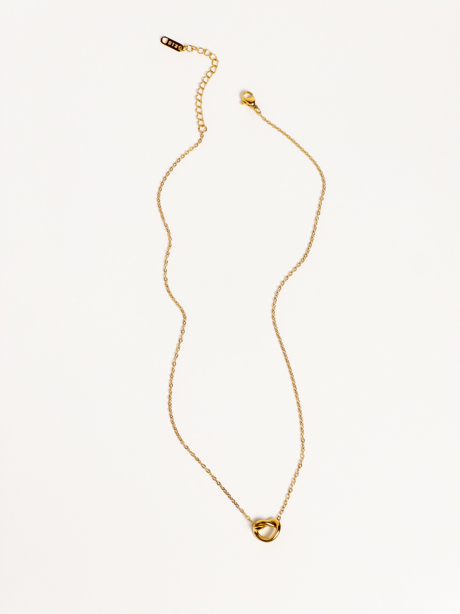 Grace Heart Necklace – gold heart knot pendant on delicate chain