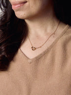 Model wearing Grace Heart gold vermeil necklace featuring a delicate heart pendant, minimalist everyday jewelry.